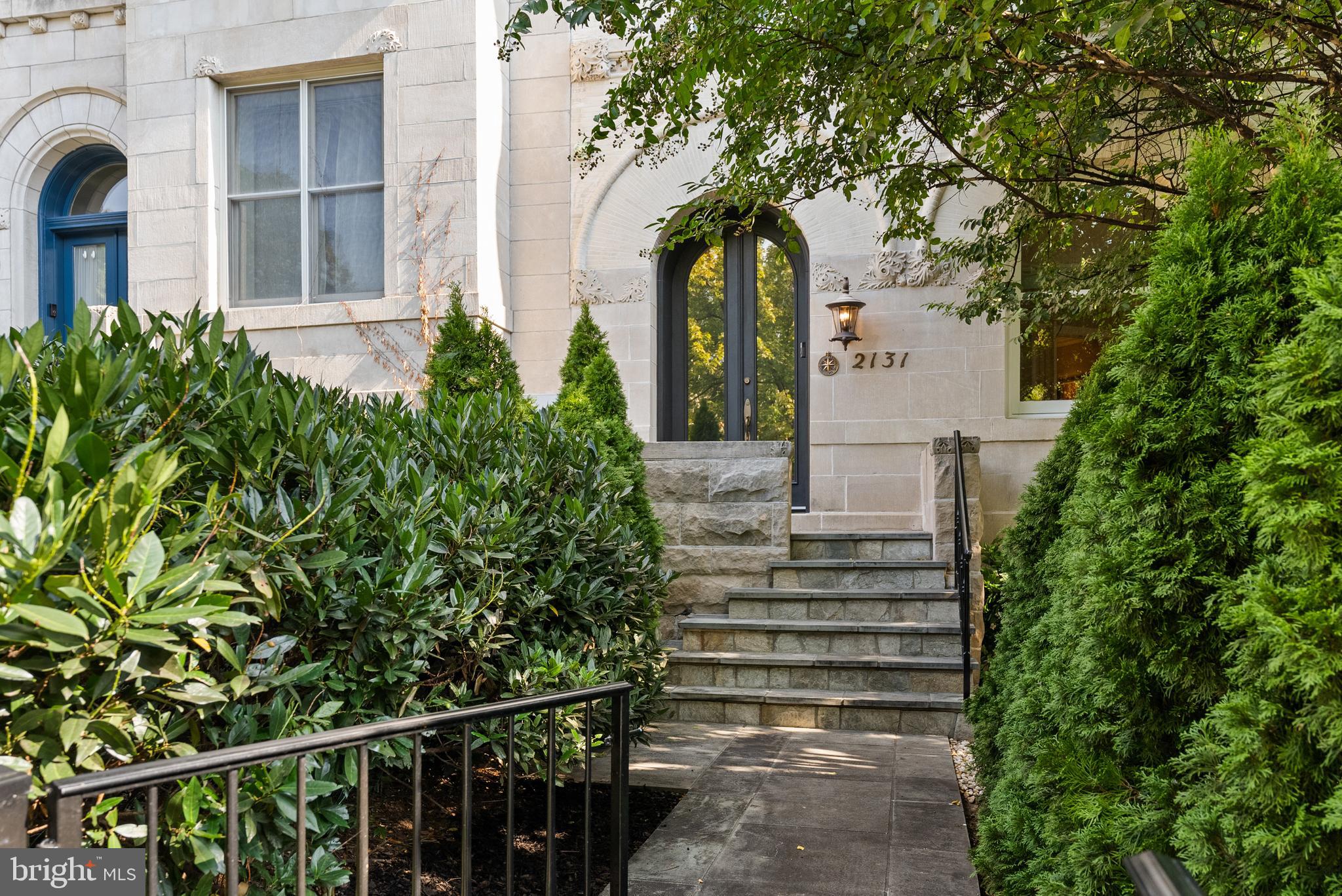 2131 S Street Northwest Washington, DC 20008 - Photo 2 of 29 a front view of a house with plants and trees
