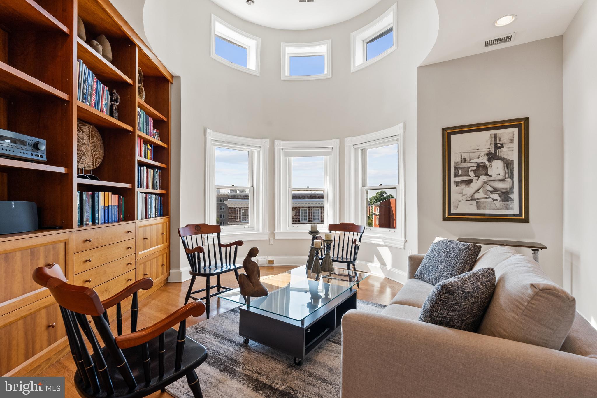 2131 S Street Northwest Washington, DC 20008 - Photo 22 of 29 a living room with furniture and a book shelf