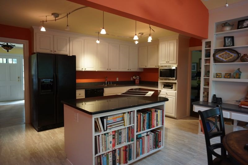 3621 Dade Street Raleigh, NC 27612 - Photo 7 of 23 The open kitchen plan has ample storage and workspace, a desk area and built-in bookcases. Kitchen