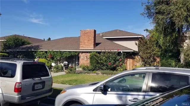 a view of a car parked in the yard