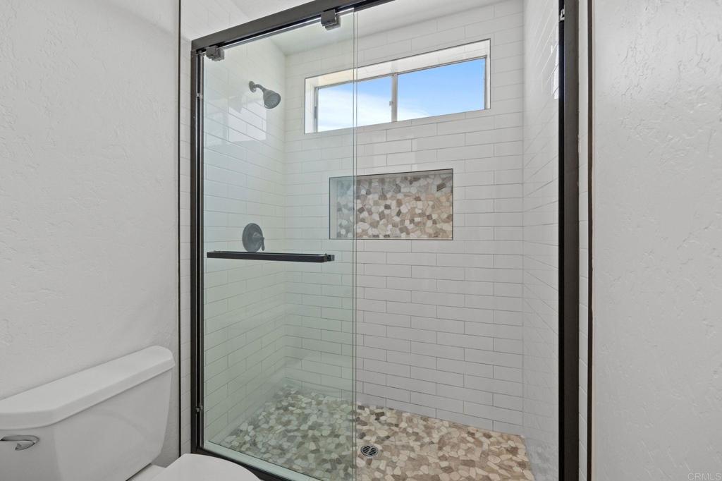 4595 Blackwell Road Oceanside, CA 92056 - Photo 30 of 47 a bathroom with a shower and a sink