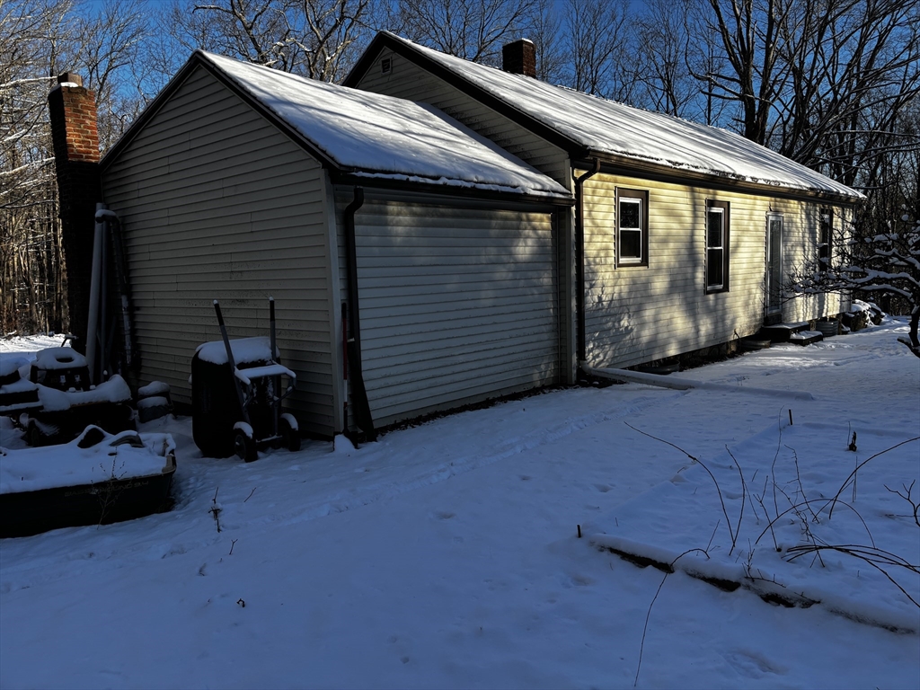 72 Northwest Schoolhouse Road Dudley, MA 01571 - Photo 2 of 5 a view of a car garage