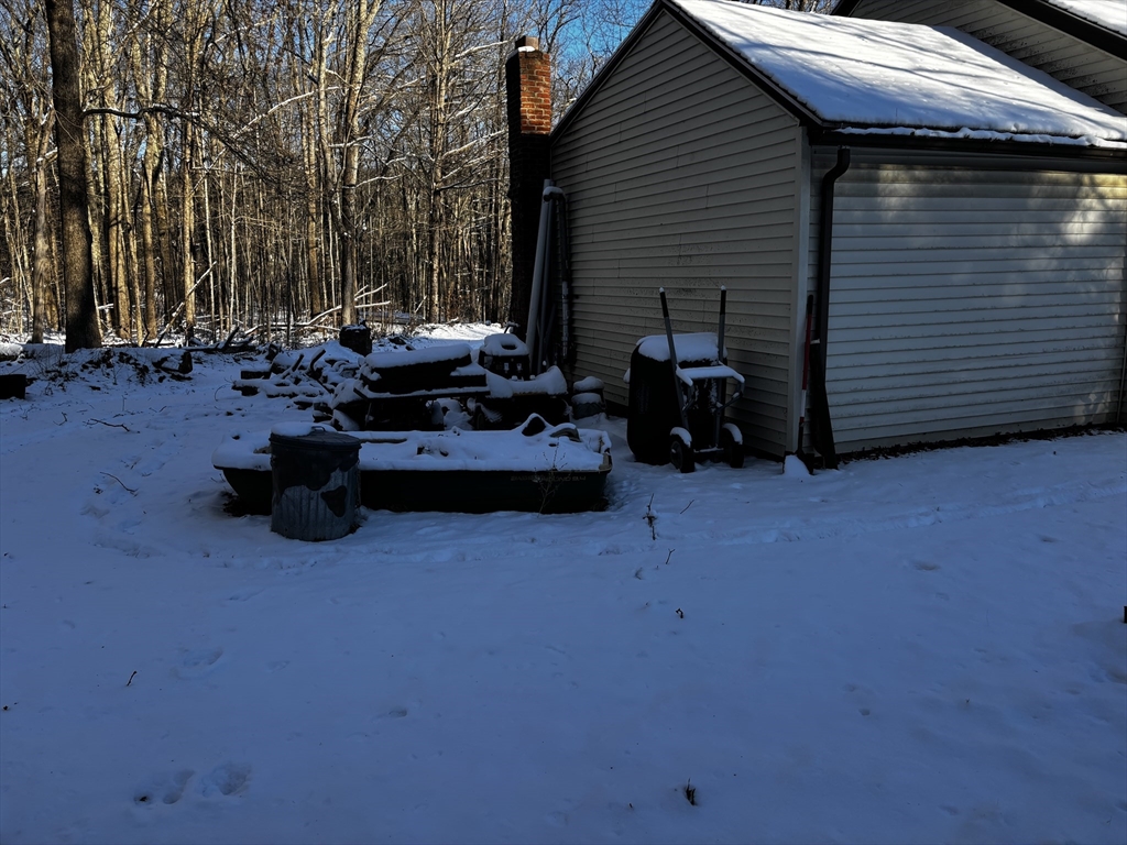 72 Northwest Schoolhouse Road Dudley, MA 01571 - Photo 3 of 5 a view of the house with a patio