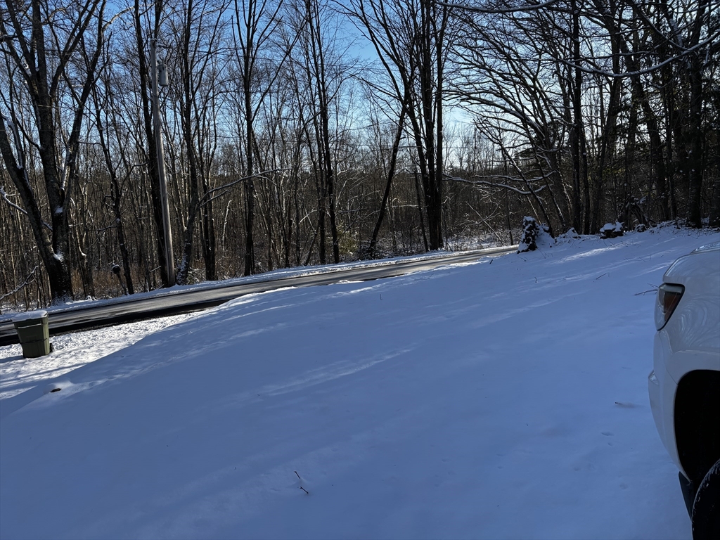 72 Northwest Schoolhouse Road Dudley, MA 01571 - Photo 4 of 5 a view of a backyard