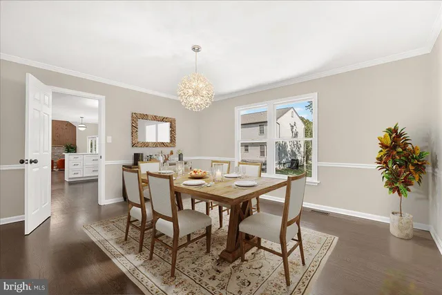 a view of a dining room with furniture and a table