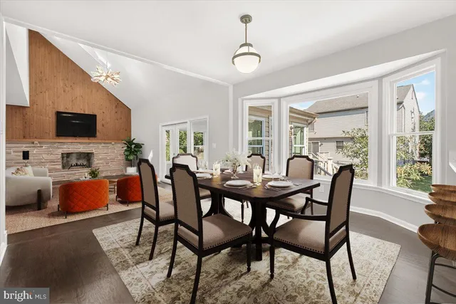 a spacious bathroom with a double vanity sink a mirror and a shower