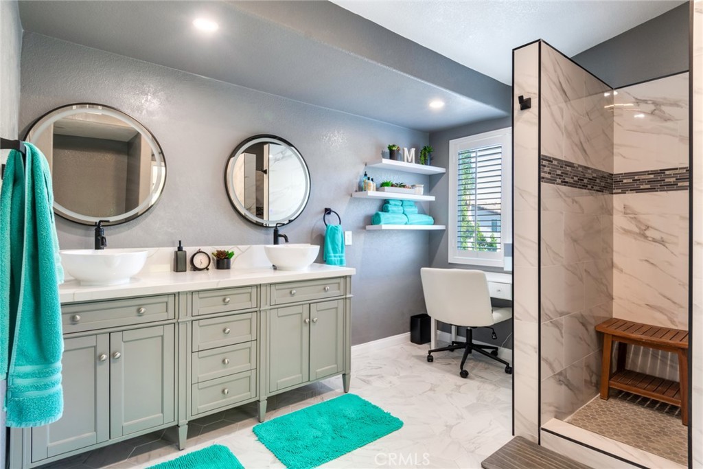 20885 Bakal Drive Riverside, CA 92508 - Photo 20 of 47 a bathroom with a toilet a sink and a mirror