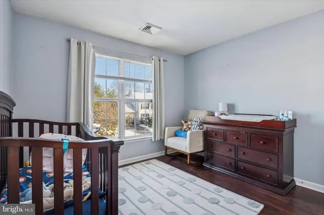 a room with a dresser and a window