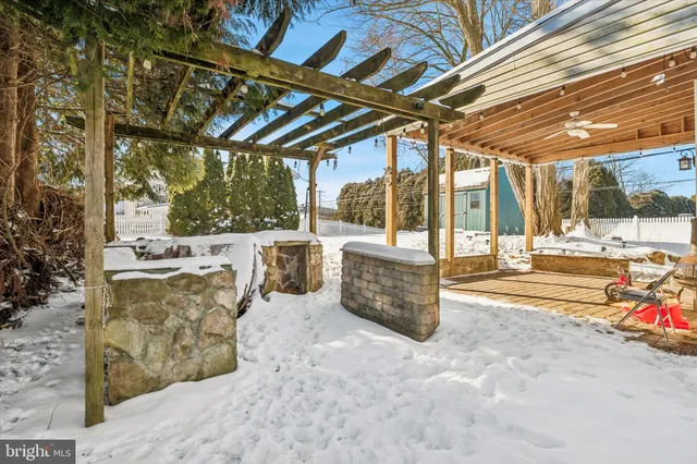 a view of a patio with a table and chairs