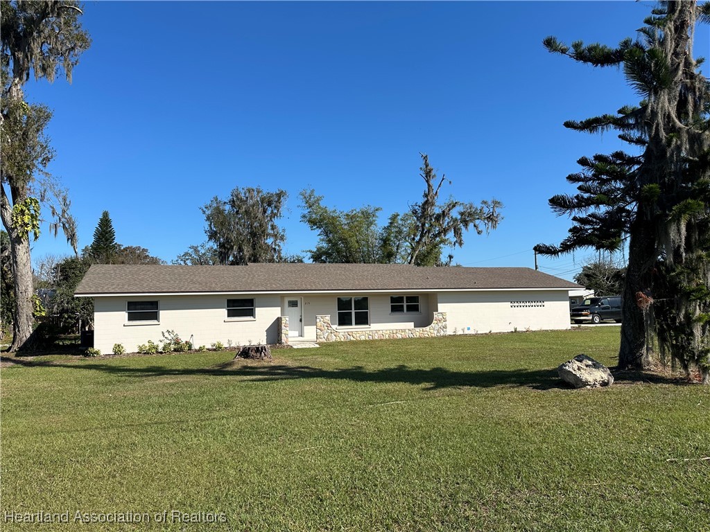 215 West Carter Road Lakeland, FL 33813 - Photo 1 of 1 a front view of a house with garden