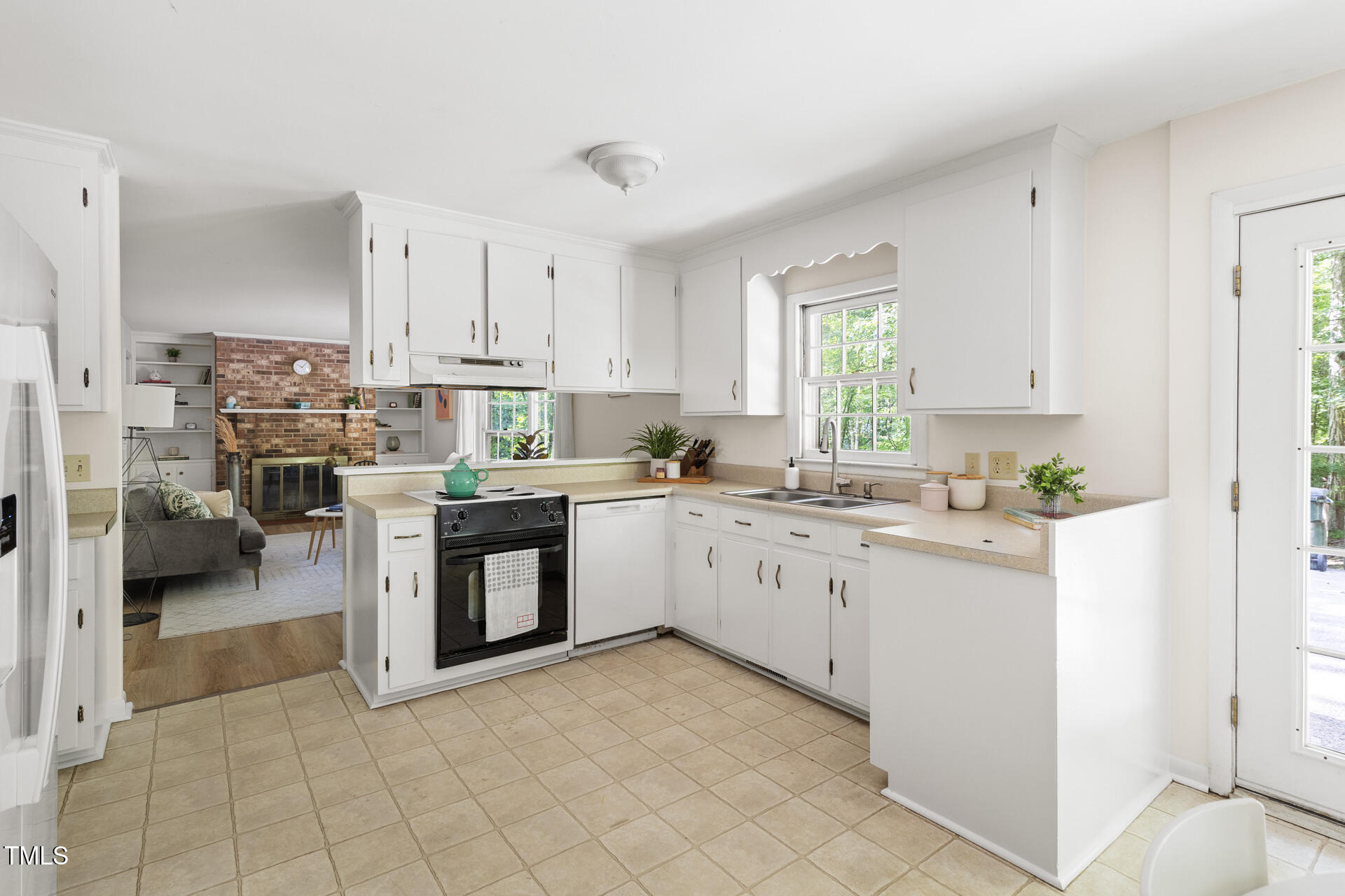 324 Woodhaven Road Chapel Hill, NC 27514 - Photo 11 of 32 a kitchen with stainless steel appliances granite countertop a stove sink and cabinets