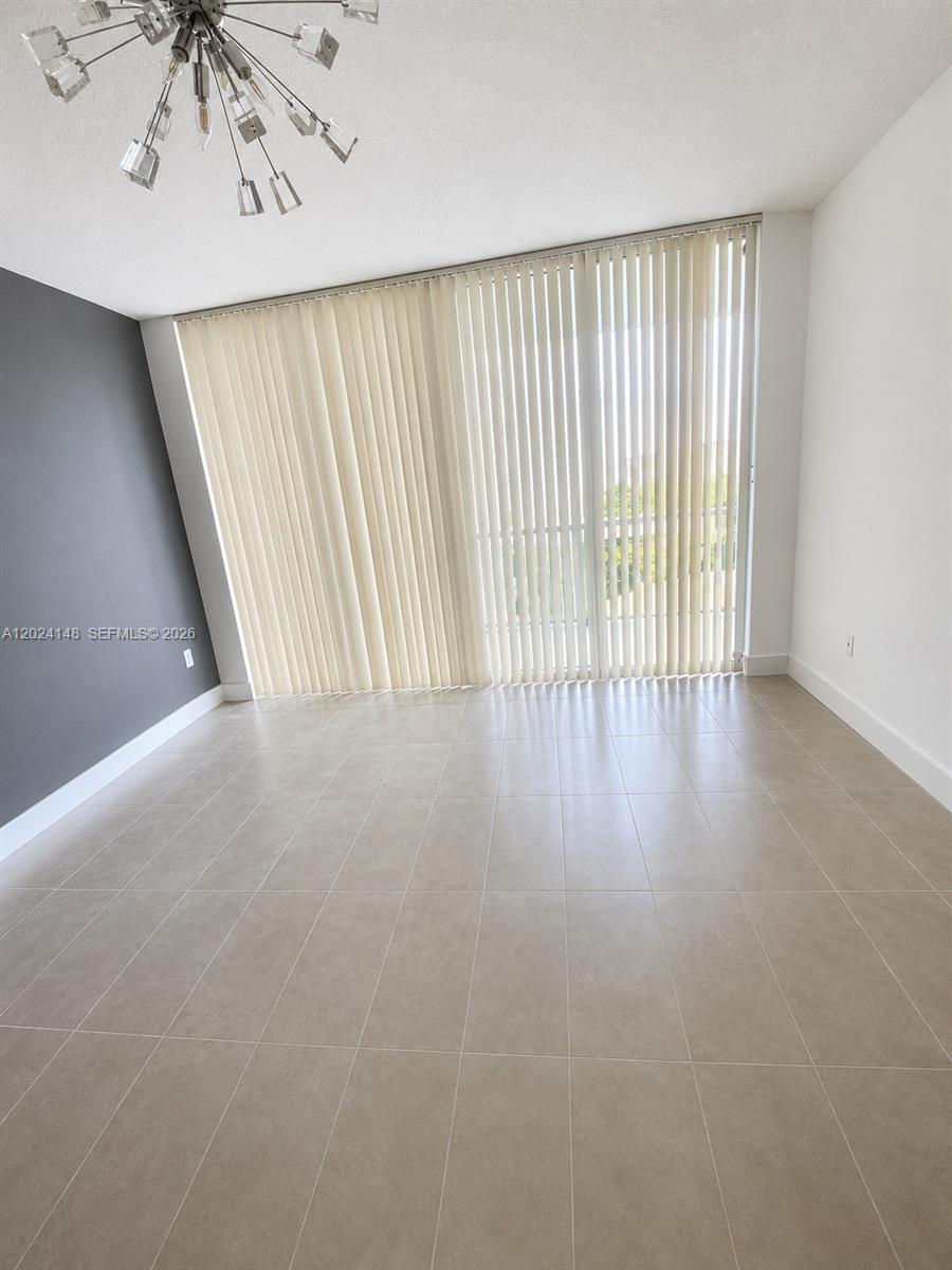 79 Southwest 12th Street, Unit 1405S Miami, FL 33130 - Photo 4 of 7 a view of a room with wooden floor