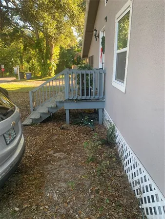 a view of a deck with wooden floor and fence