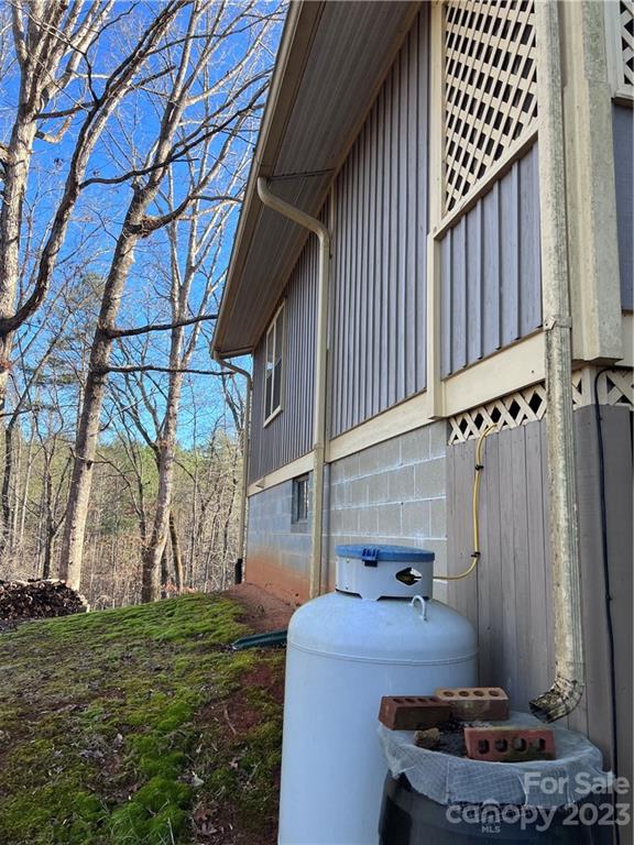 6756 Highway 9 Mill Spring, NC 28756 - Photo 14 of 46 a backyard of a house with fountain table and chairs