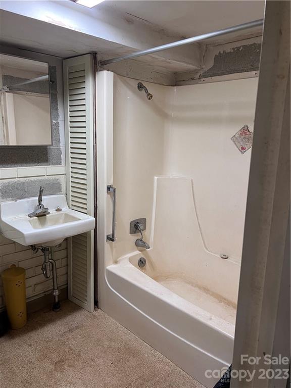 6756 Highway 9 Mill Spring, NC 28756 - Photo 24 of 46 a bathroom with a sink and a mirror