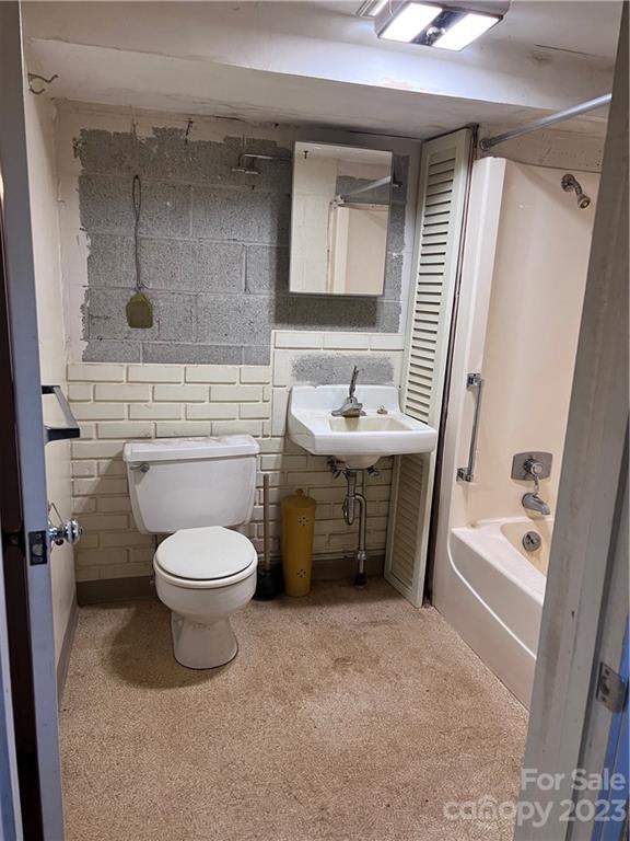 6756 Highway 9 Mill Spring, NC 28756 - Photo 25 of 46 a bathroom with a sink a toilet and shower