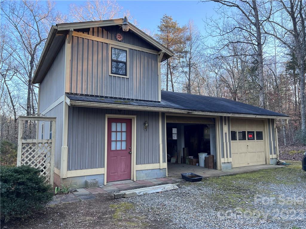 6756 Highway 9 Mill Spring, NC 28756 - Photo 3 of 46 a front view of a house with garden