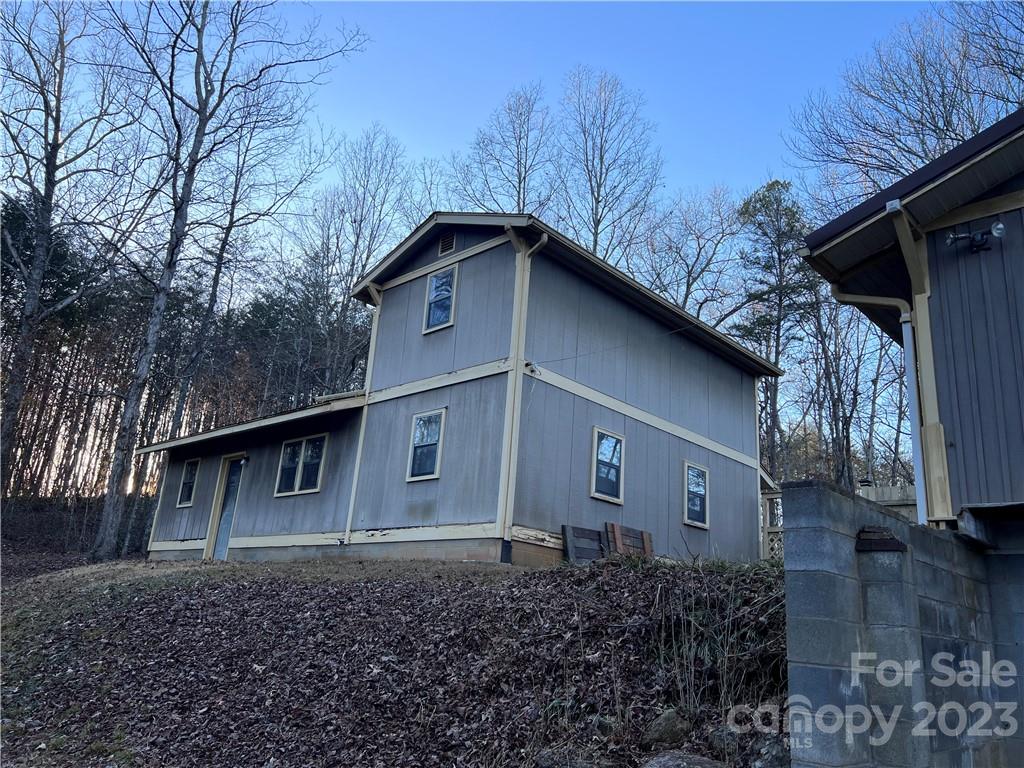 6756 Highway 9 Mill Spring, NC 28756 - Photo 8 of 46 a house with trees in the background