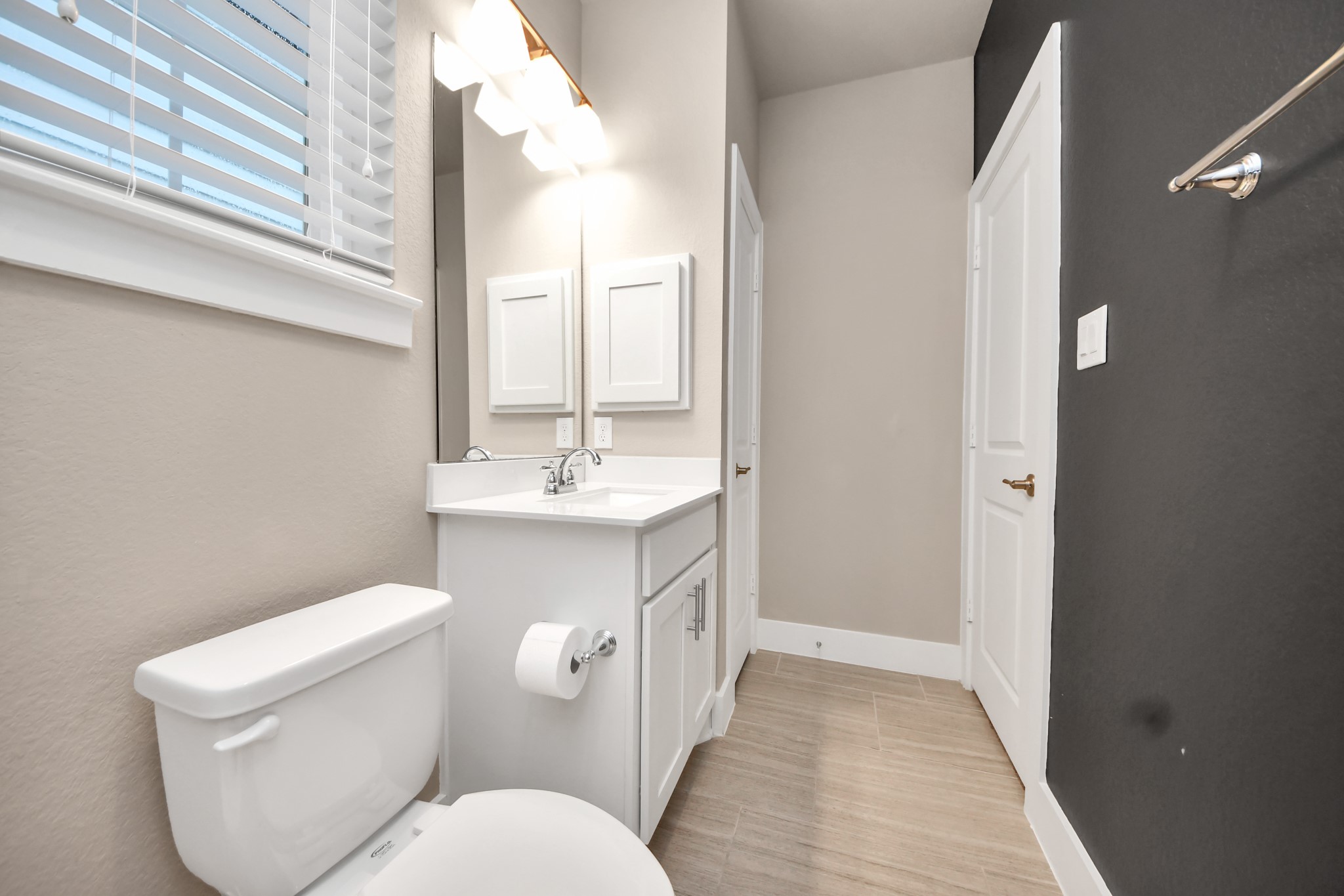 2704 Freund Street Houston, TX 77003 - Photo 25 of 45 a bathroom with a toilet sink and mirror