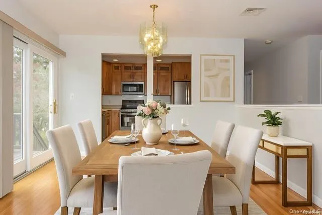 a kitchen with stainless steel appliances granite countertop a refrigerator stove microwave and sink