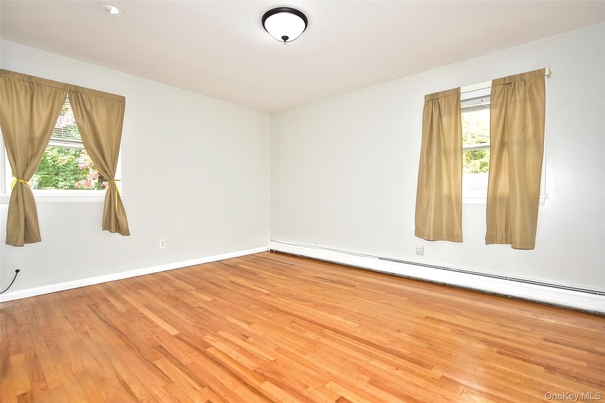 33 Hillcrest Road Suffern, NY 10901 - Photo 16 of 39 Unfurnished room featuring a baseboard radiator and light wood finished floors