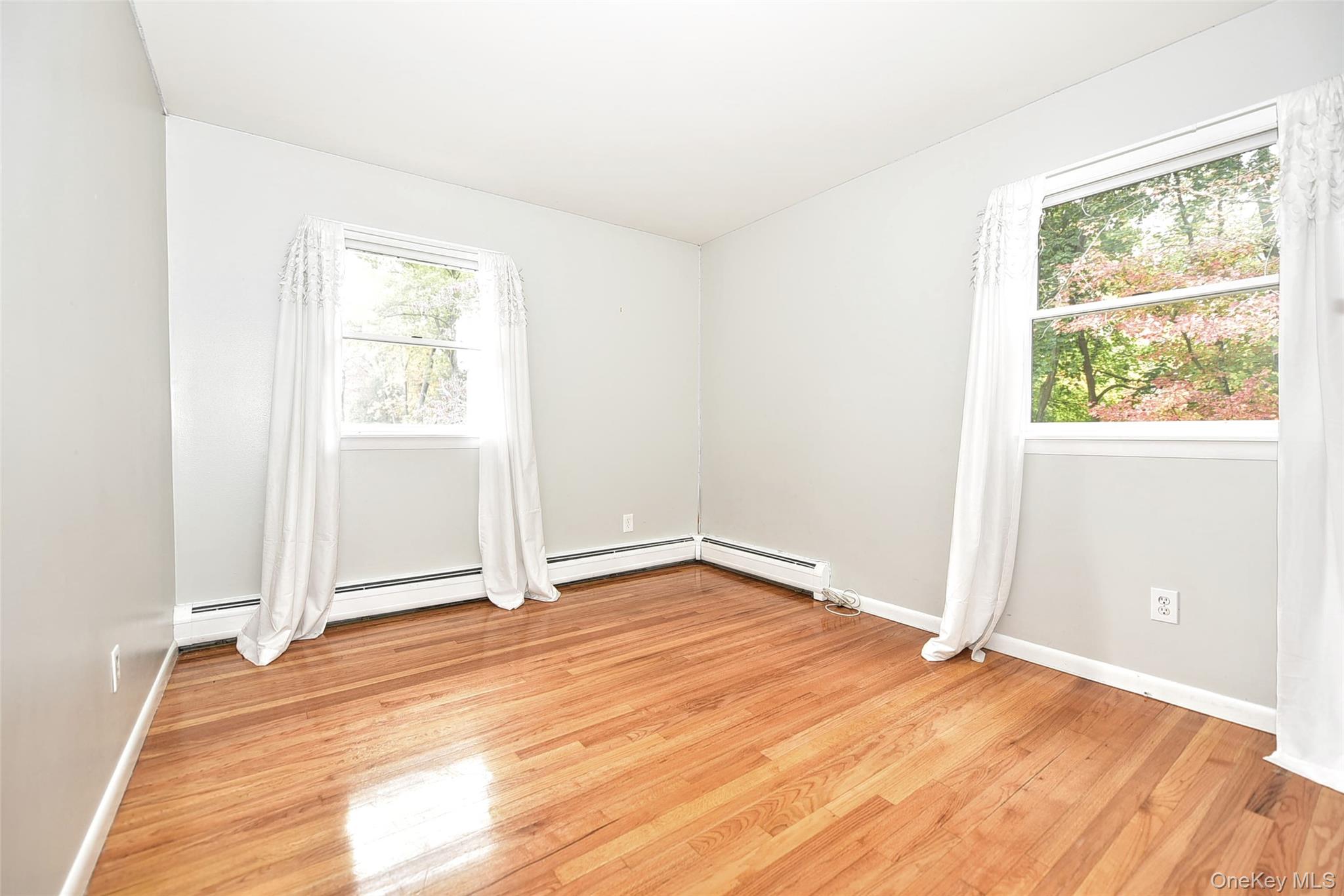 33 Hillcrest Road Suffern, NY 10901 - Photo 18 of 39 Spare room featuring light wood-style flooring and baseboard heating