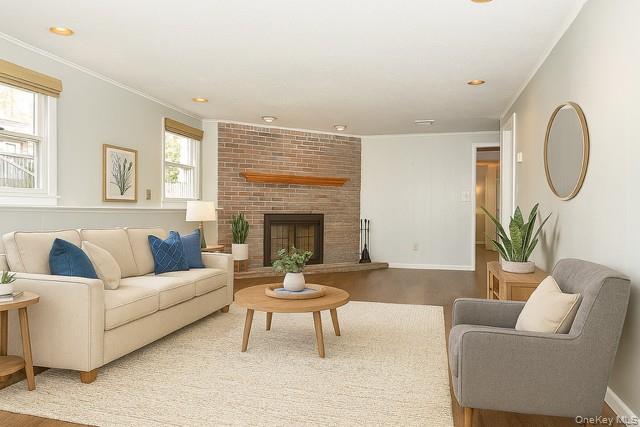 33 Hillcrest Road Suffern, NY 10901 - Photo 25 of 39 Staged - Living room with wood finished floors, a fireplace, recessed lighting, and crown molding