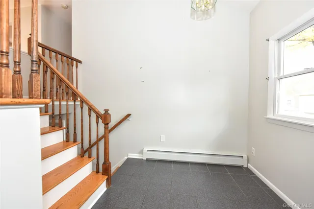 a bathroom with a sink a mirror and a window
