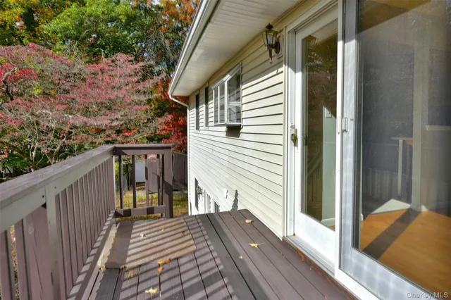 a view of a balcony with wooden floor