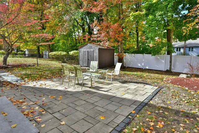 a view of house with backyard and garden