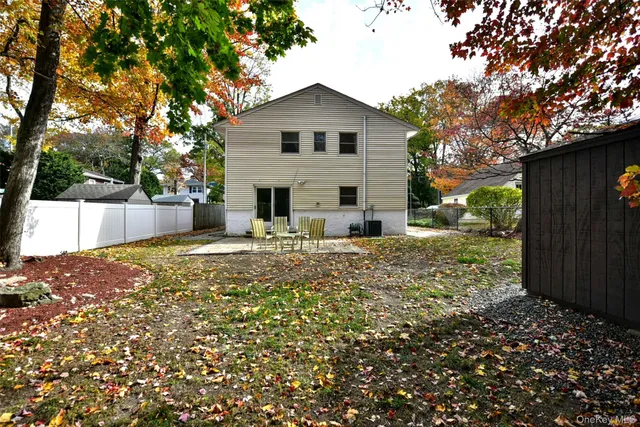 a house with trees in the background