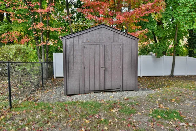 a backyard of a house with a tree