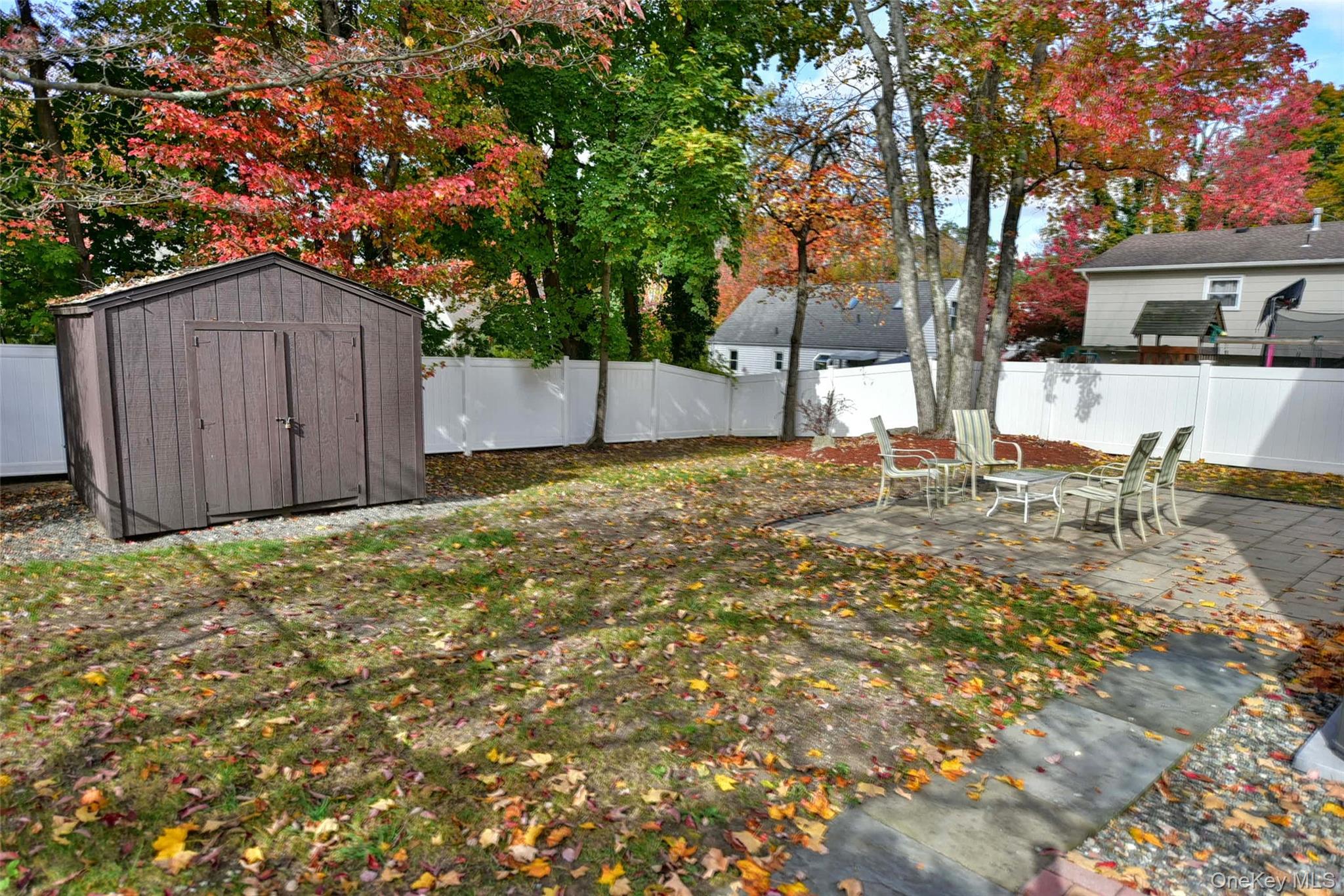 33 Hillcrest Road Suffern, NY 10901 - Photo 38 of 39 Fenced backyard with a patio area and a storage unit