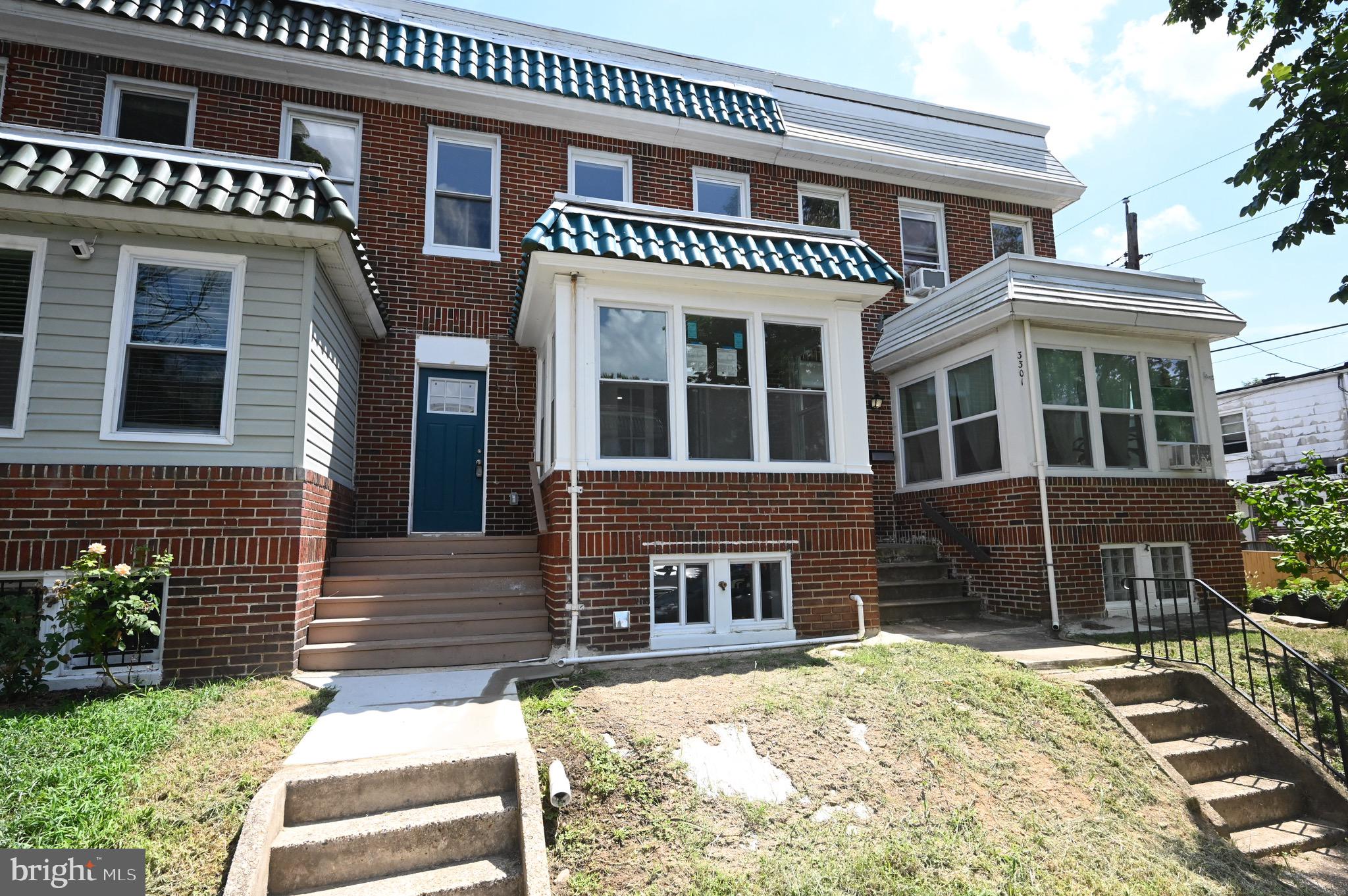 3303 Westerwald Avenue Baltimore, MD 21218 - Photo 22 of 28 a front view of a house with a yard