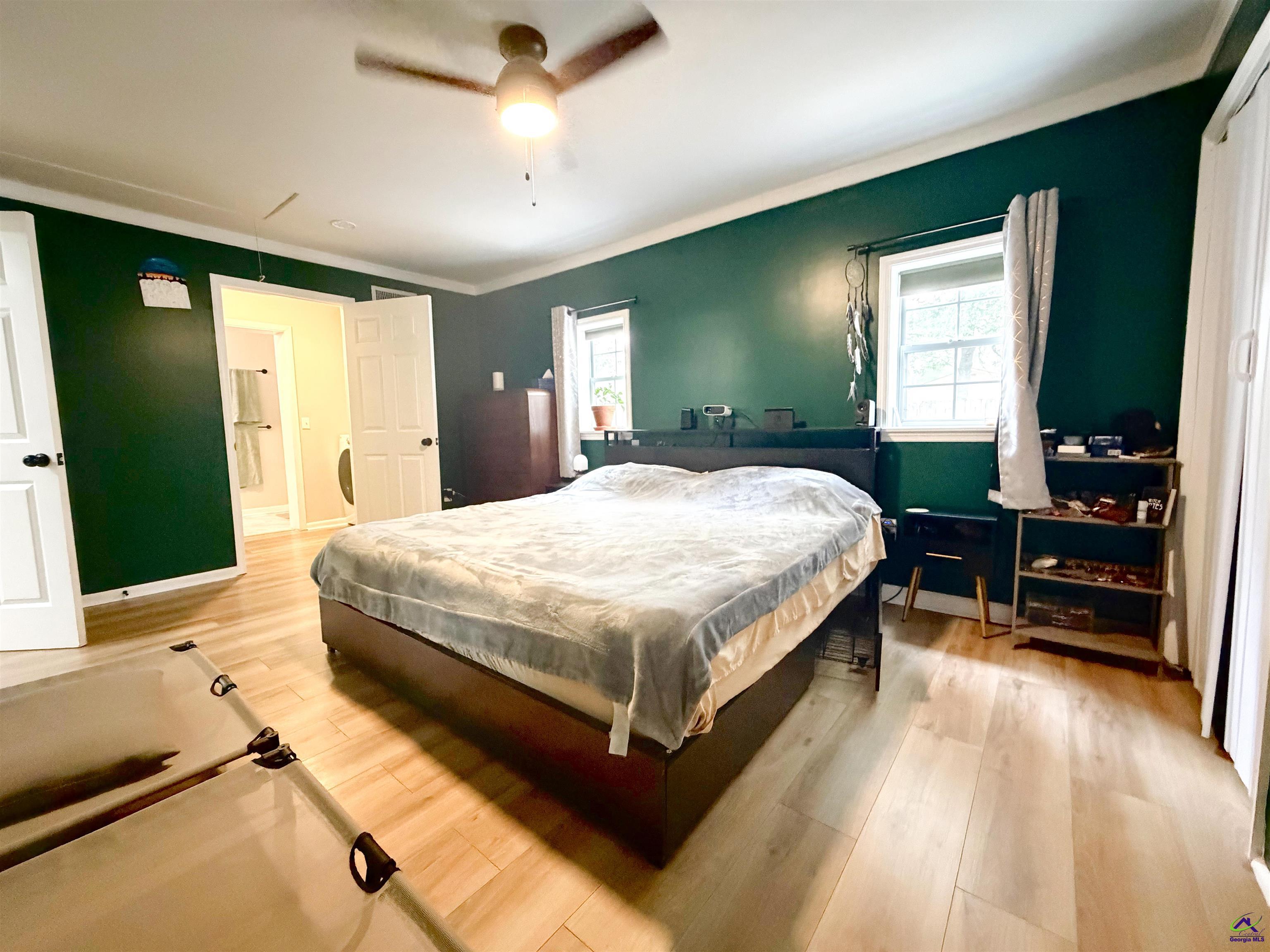 108 Weaver Road Warner Robins, GA 31093 - Photo 10 of 26 a bedroom with a bed and a dresser