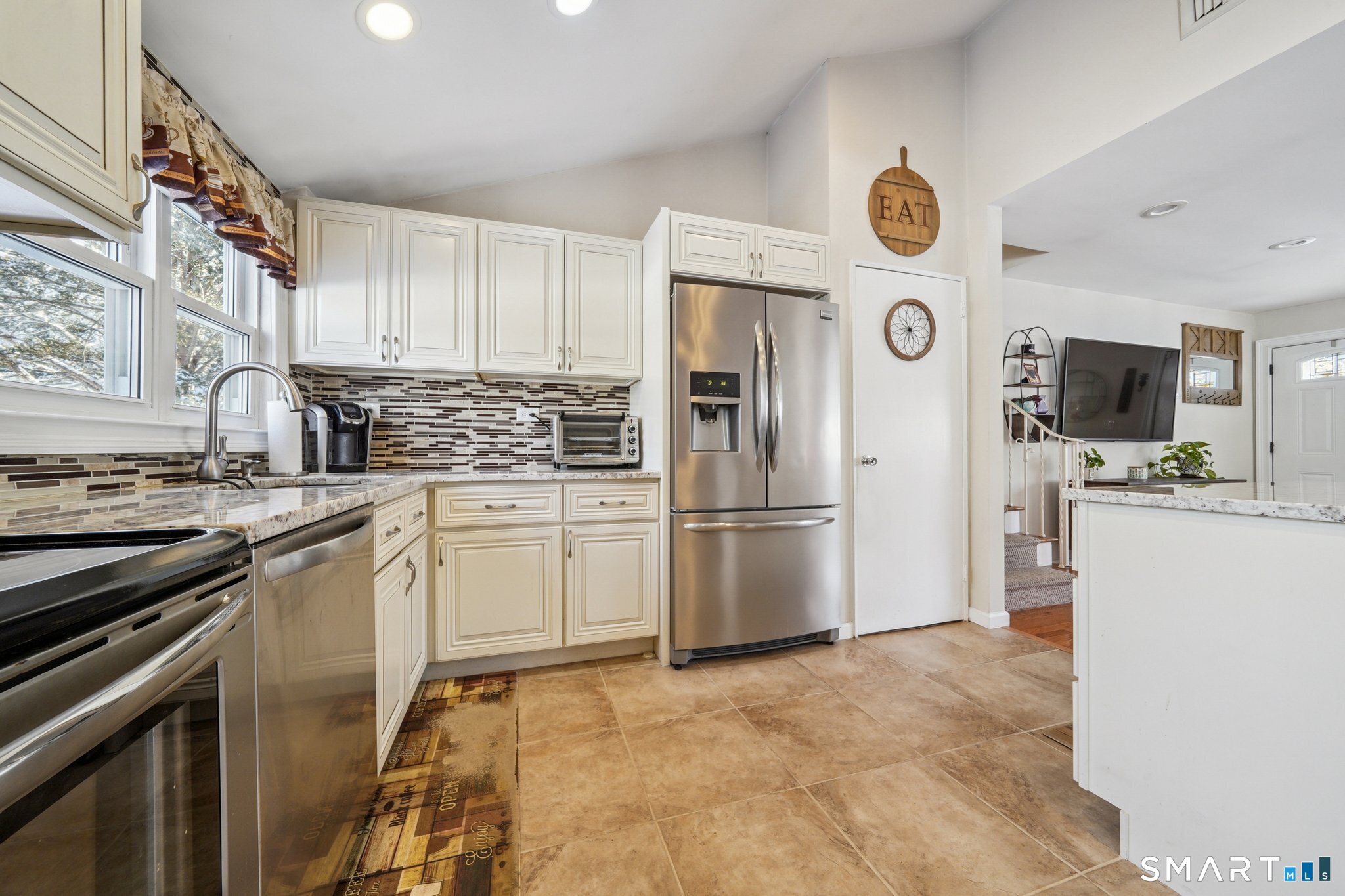 10 Algonquin Road Norwalk, CT 06851 - Photo 6 of 24 Remodeled kitchen with island and tile flooring!