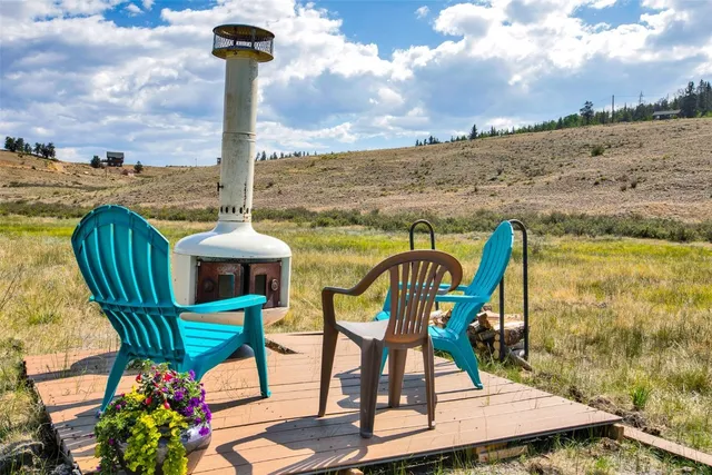 a view of a chairs and table in the patio