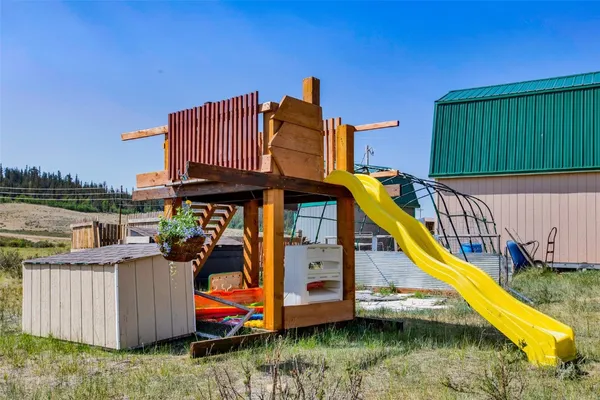 a view of a house with swimming pool and sitting area