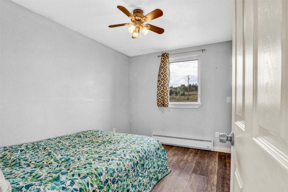 59 Chief Trail Como, CO 80456 - Photo 22 of 44 a bedroom with a bed and a window