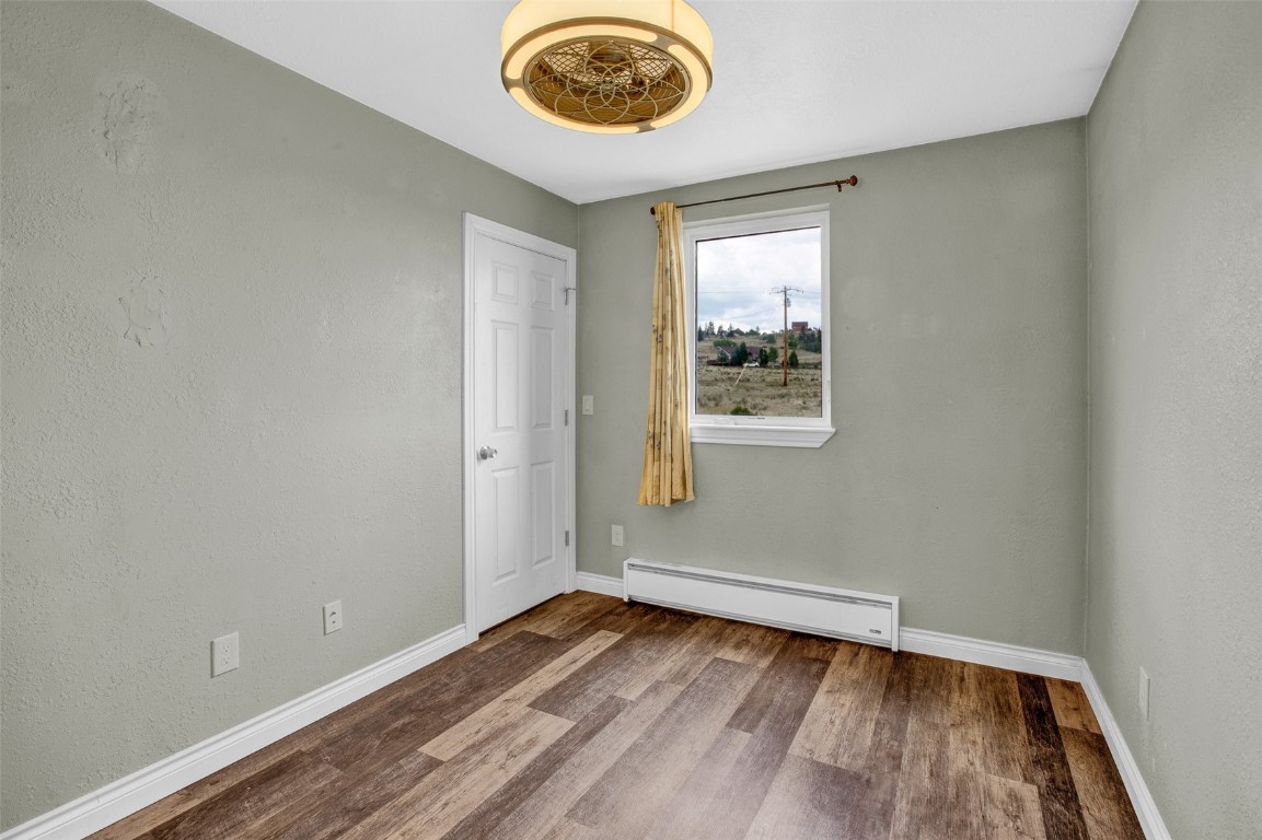 59 Chief Trail Como, CO 80456 - Photo 25 of 44 wooden floor in a room next to a window