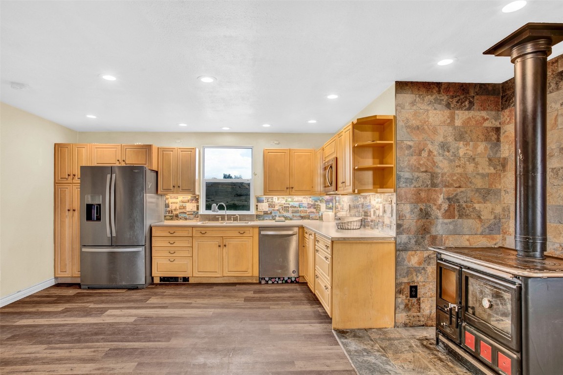 59 Chief Trail Como, CO 80456 - Photo 40 of 44 a kitchen with stainless steel appliances granite countertop a refrigerator a stove and a sink