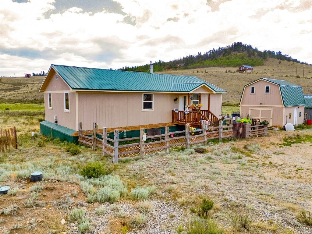59 Chief Trail Como, CO 80456 - Photo 6 of 44 a view of a house with a yard and sitting area