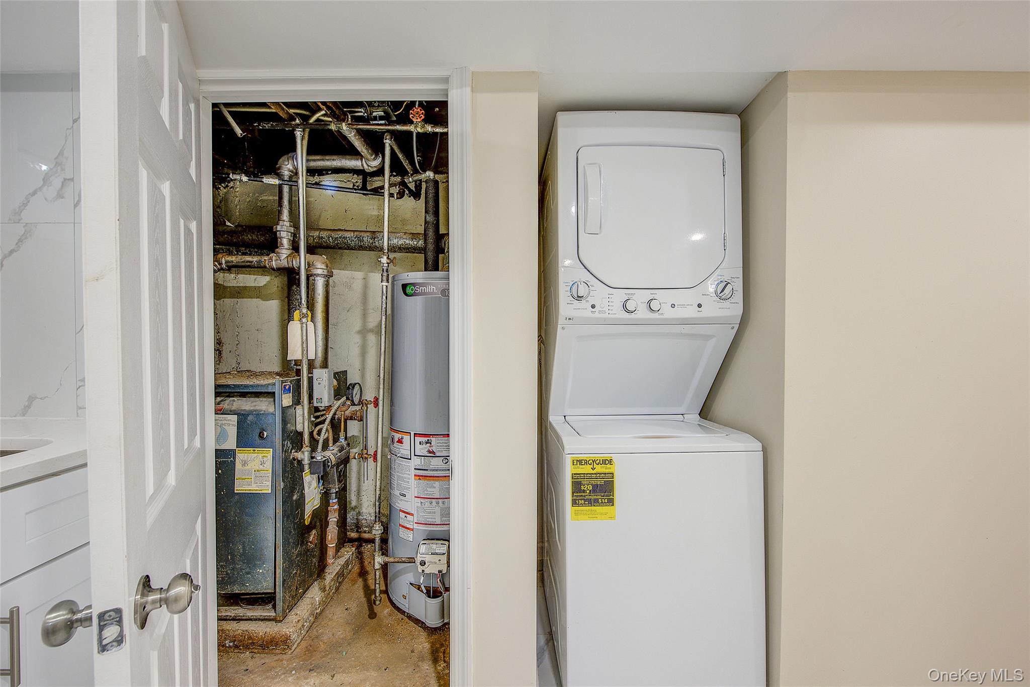 164-38 76th Road Queens, NY 11366 - Photo 29 of 44 a utility room with dryer and washer