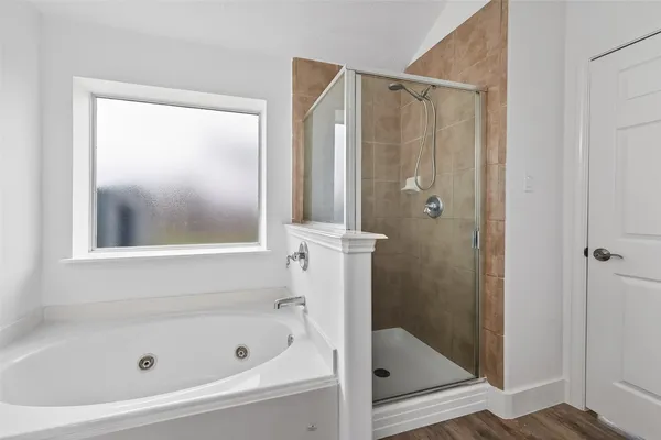 a bathroom with a glass shower door