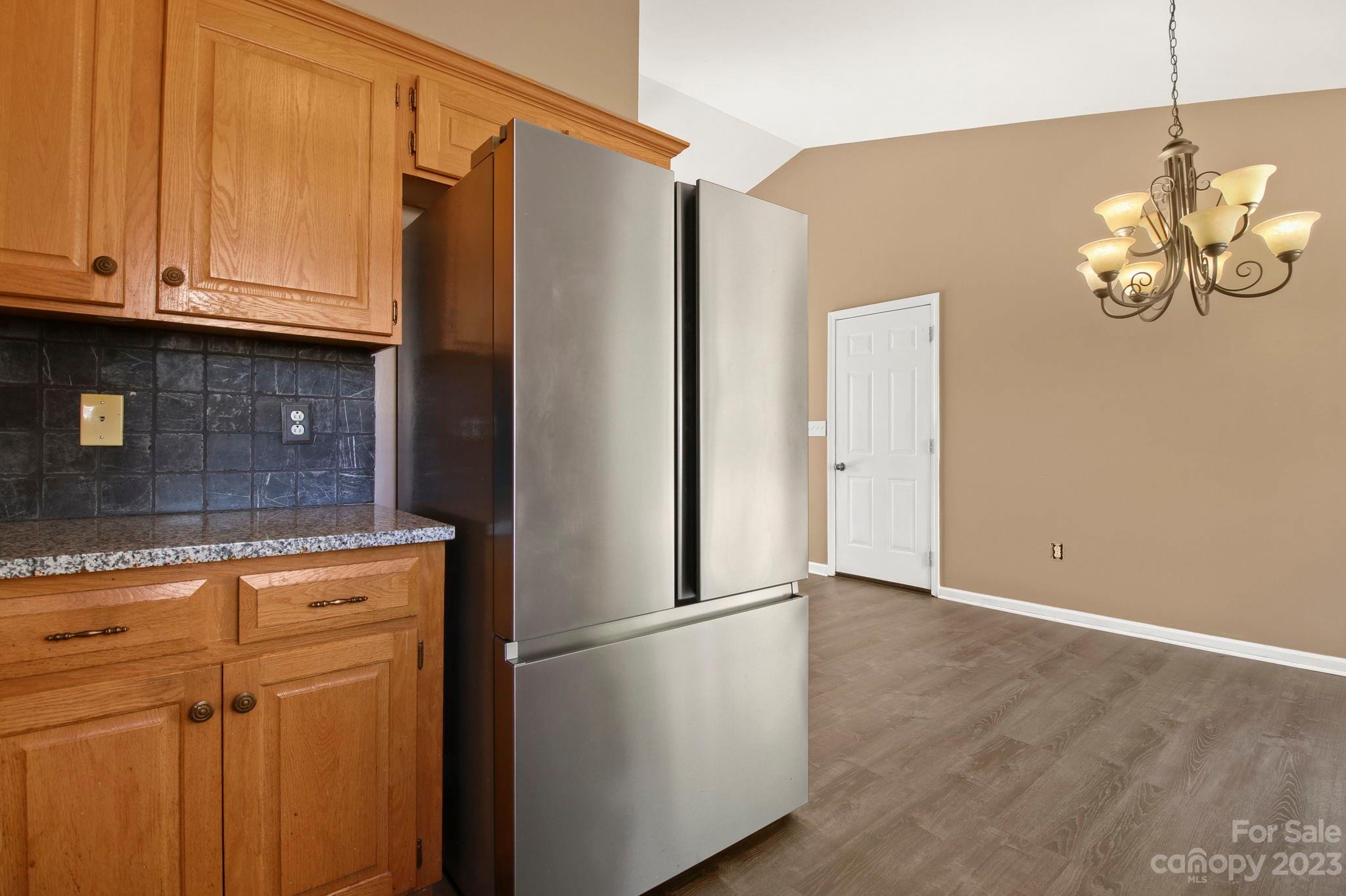 4863 Water Wheel Drive Conover, NC 28613 - Photo 11 of 32 a kitchen with stainless steel appliances granite countertop a refrigerator a microwave and cabinets