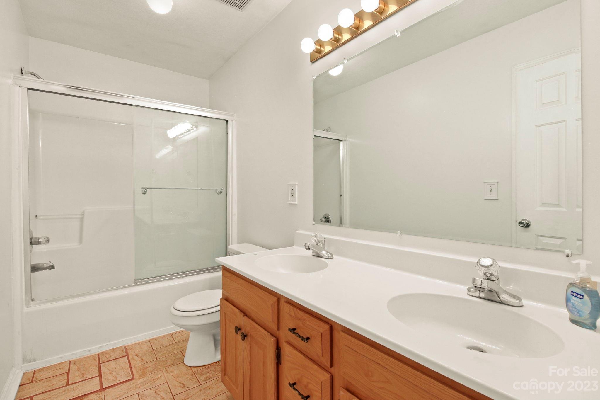 4863 Water Wheel Drive Conover, NC 28613 - Photo 17 of 32 a bathroom with a sink a toilet and shower