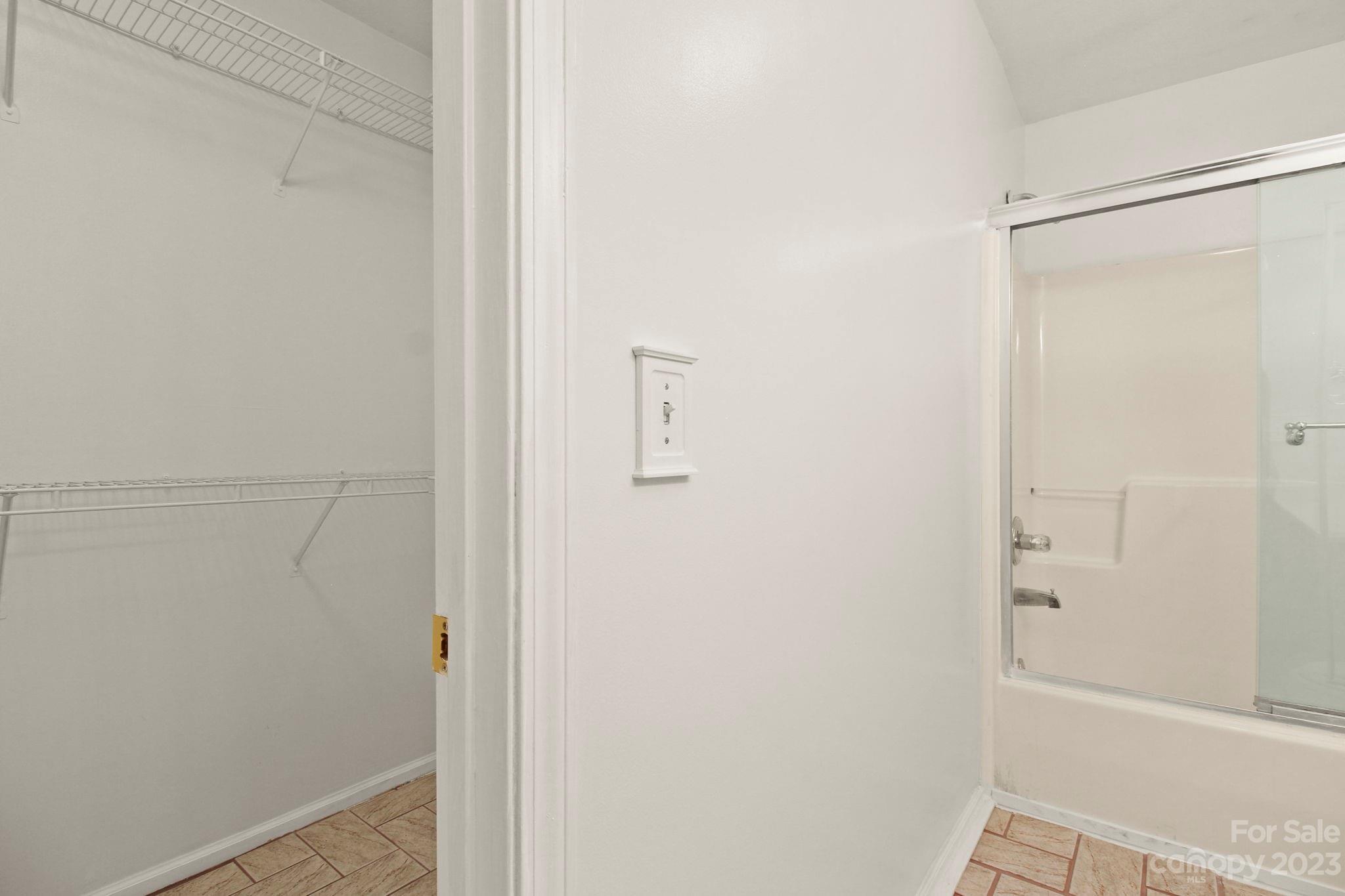 4863 Water Wheel Drive Conover, NC 28613 - Photo 19 of 32 a bathroom with a glass shower door