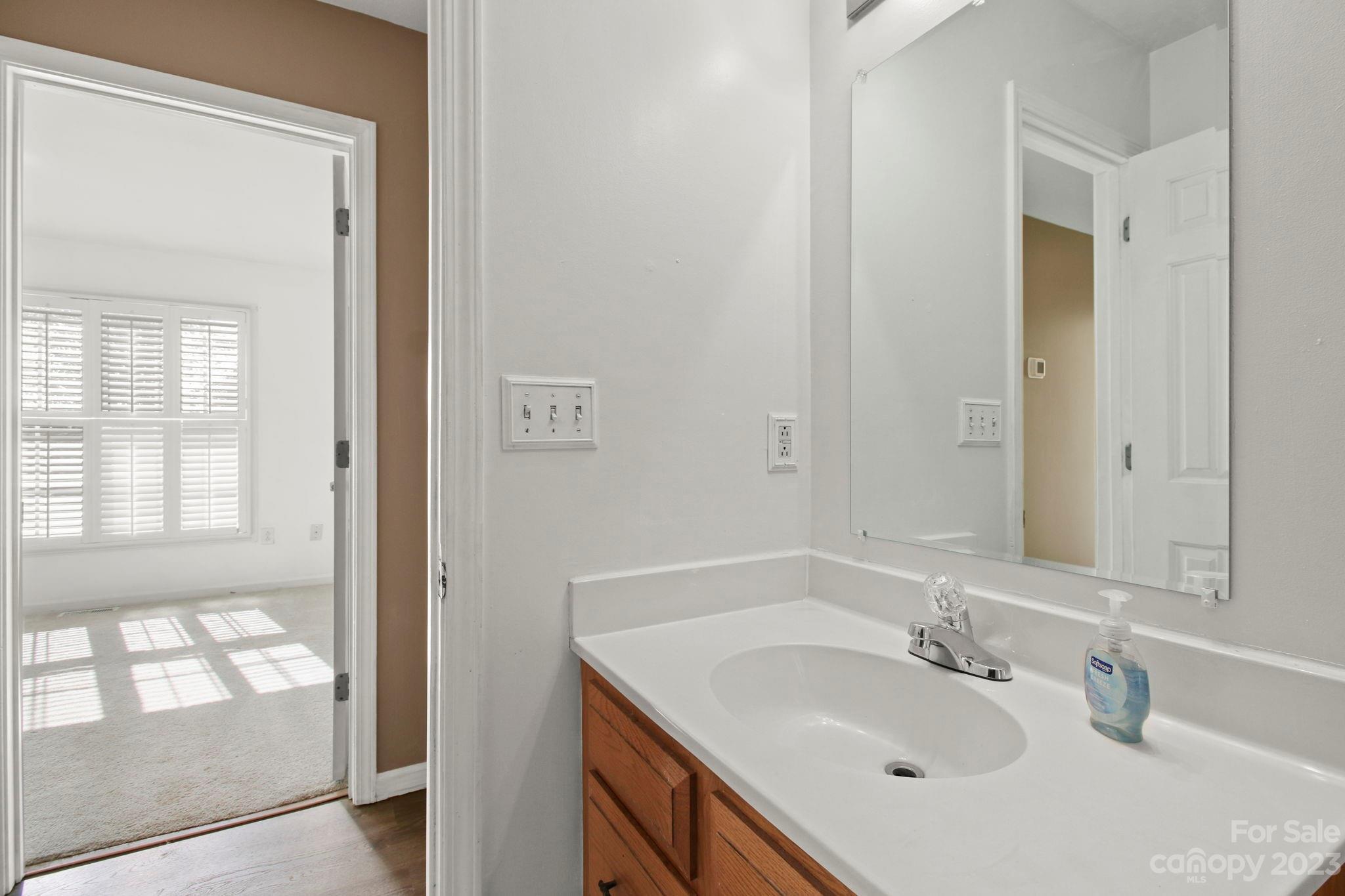 4863 Water Wheel Drive Conover, NC 28613 - Photo 25 of 32 a bathroom with a sink vanity granite tub and a mirror