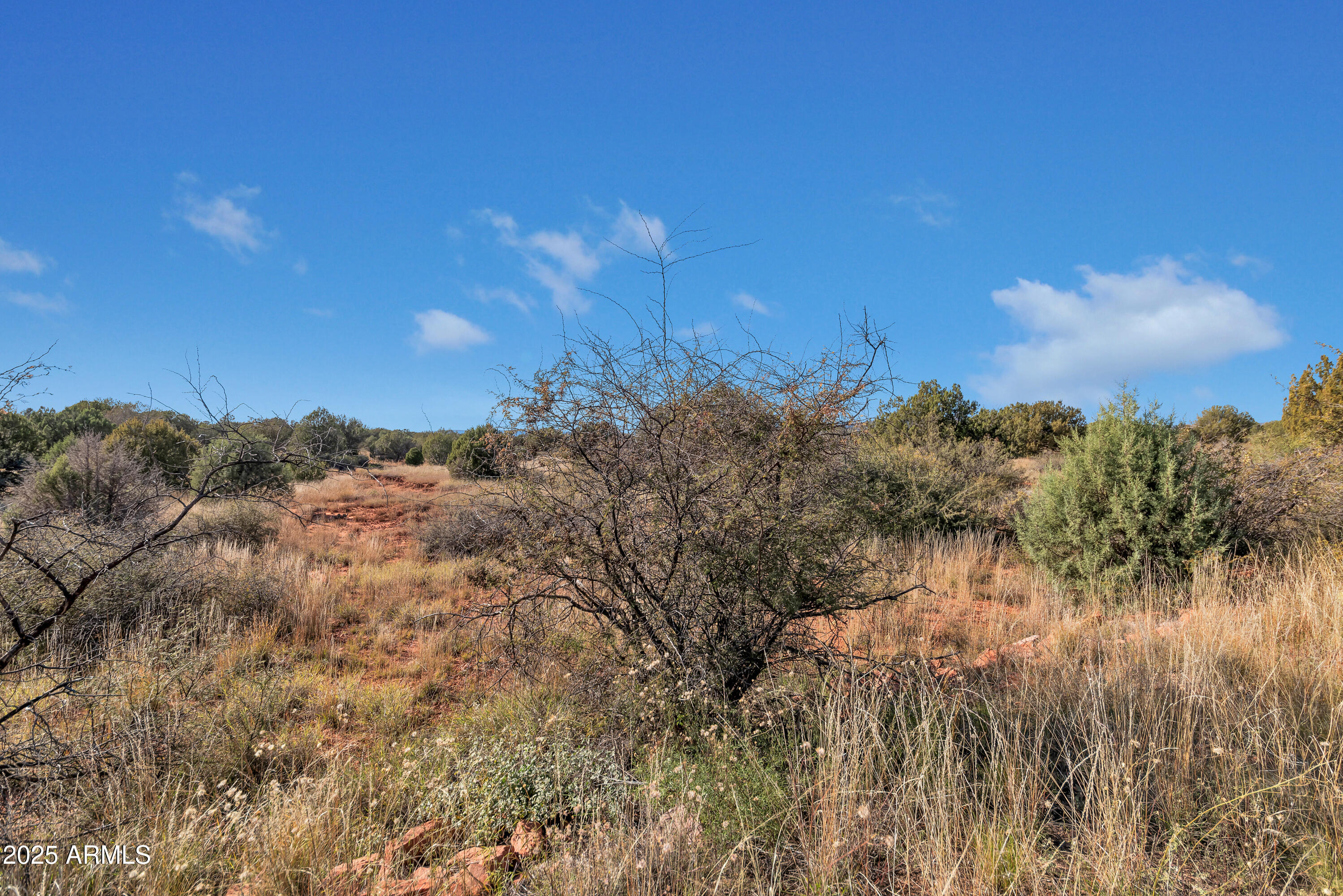 75 Estrella Road, Unit 3 Sedona, AZ 86336 - Photo 17 of 28 a view of a large building with mountain in the background
