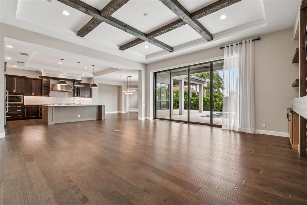 10605 Sabella Drive Trinity, FL 34655 - Photo 11 of 77 a view of an empty room with wooden floor and a window